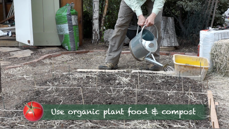 Kaye waters freshly planted corn seed on Late Bloomer Episode 33 Late Bloomer-Transition from Winter to Summer-3
