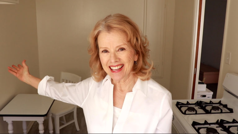 Kaye Kittrell in white kitchen